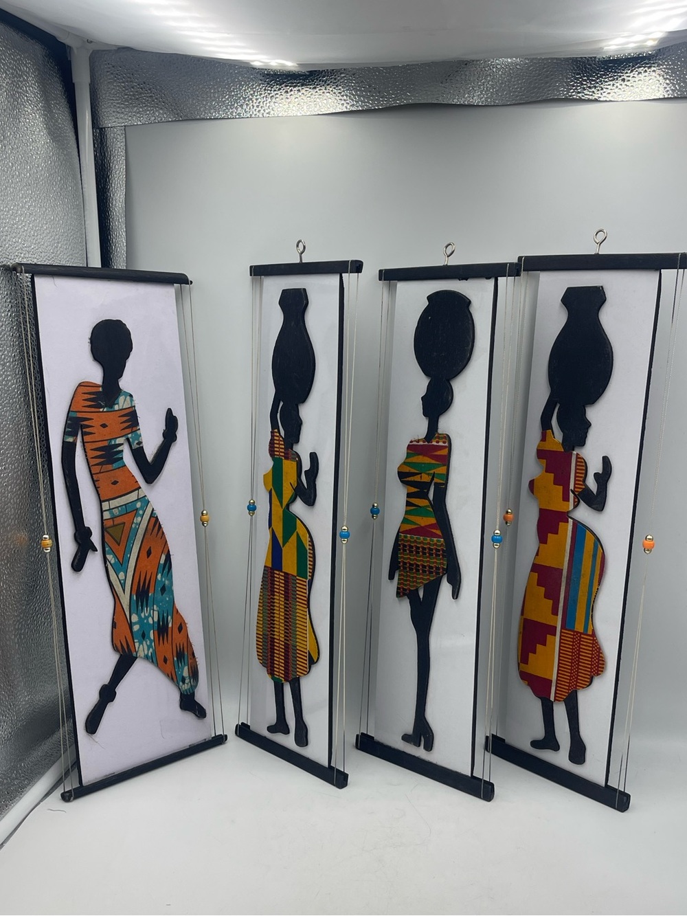 Hand Crafted African Wooden Wall Art: Women Silhouettes Adorned in Kente Fabrics